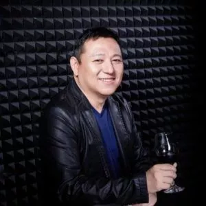 Ethan Soo with a glass of wine